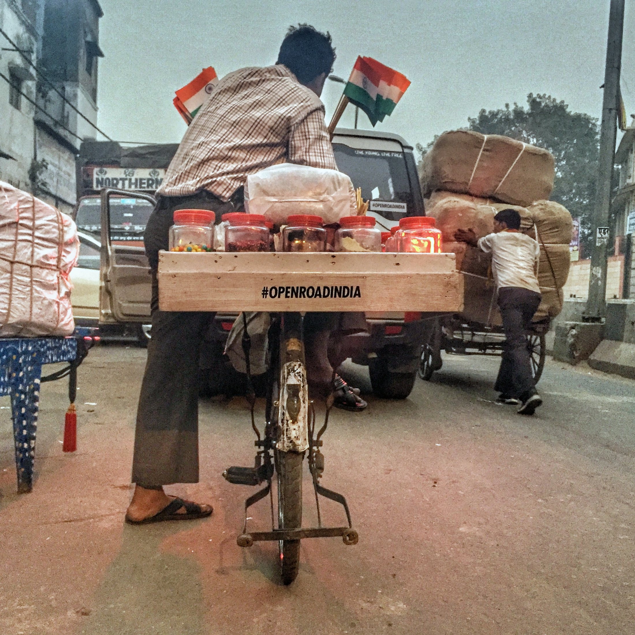 A cart on the move, carrying our sticker. â€” Delhi Â· Nov 2015