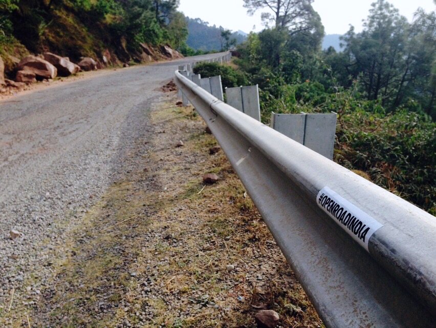 The open mountain road â€” our sticker riding along. â€” Himachal Pradesh