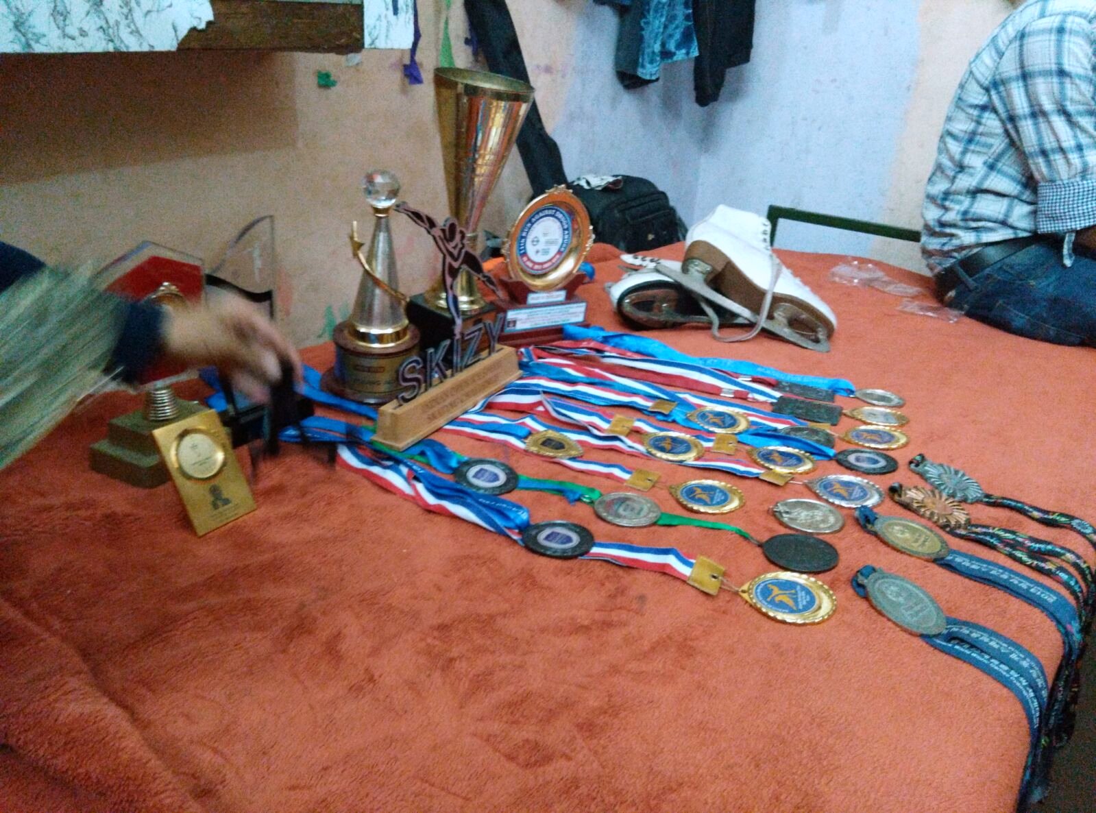 Every medal the ice skater had won. â€” Delhi