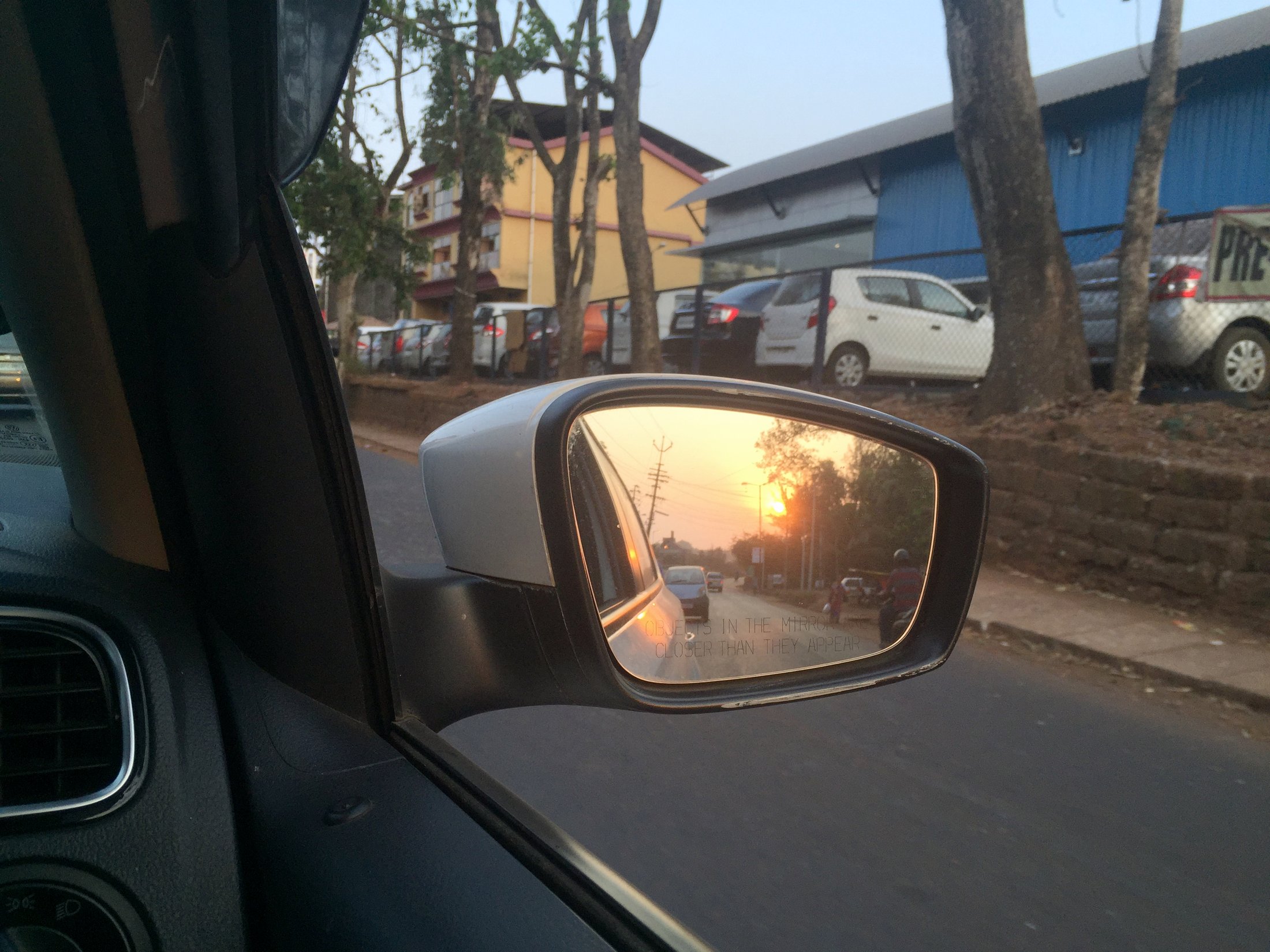 Sunset in the side mirror. â€” Bicholim, Goa Â· Mar 2016